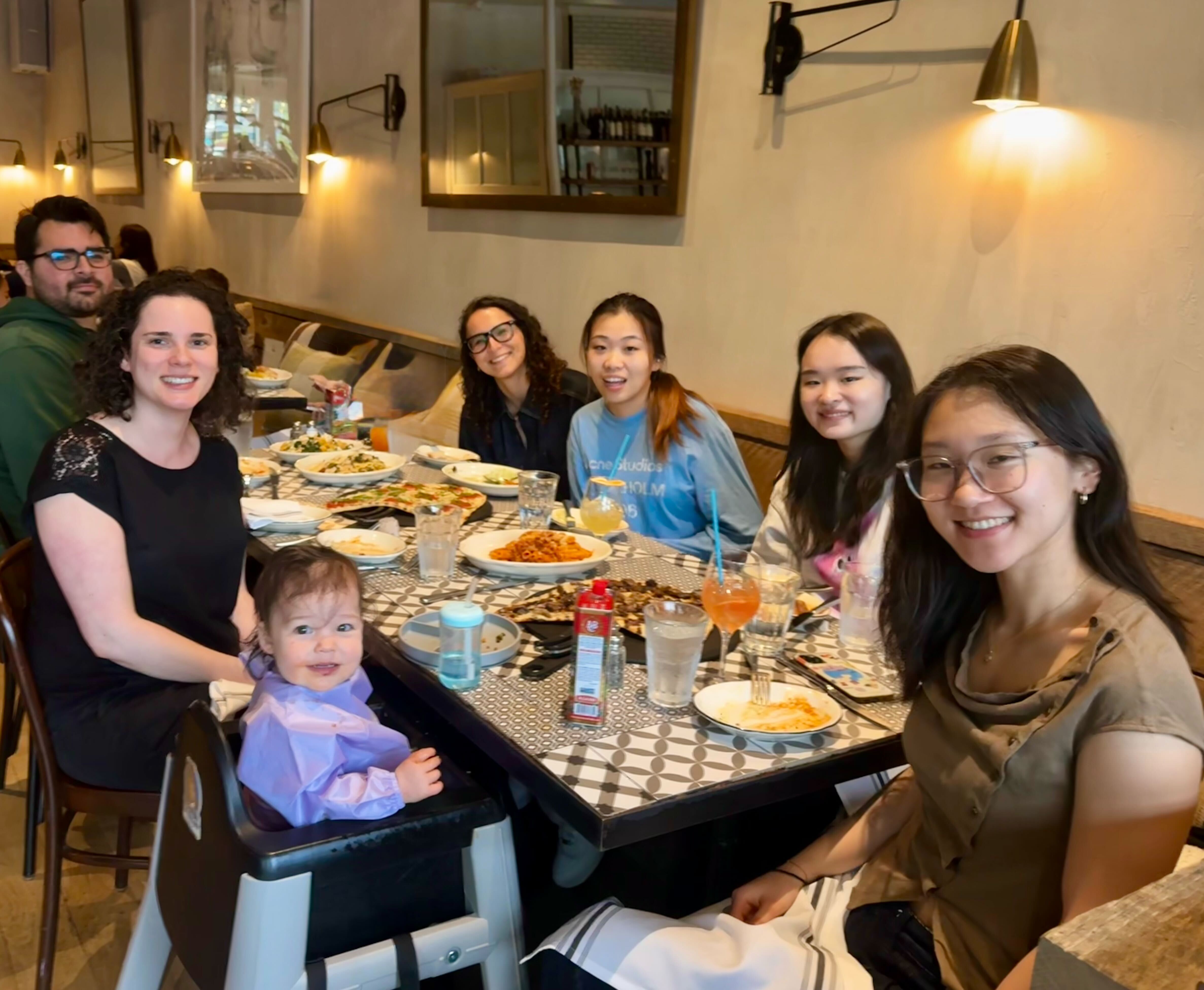 The lab enjoying food and drinks