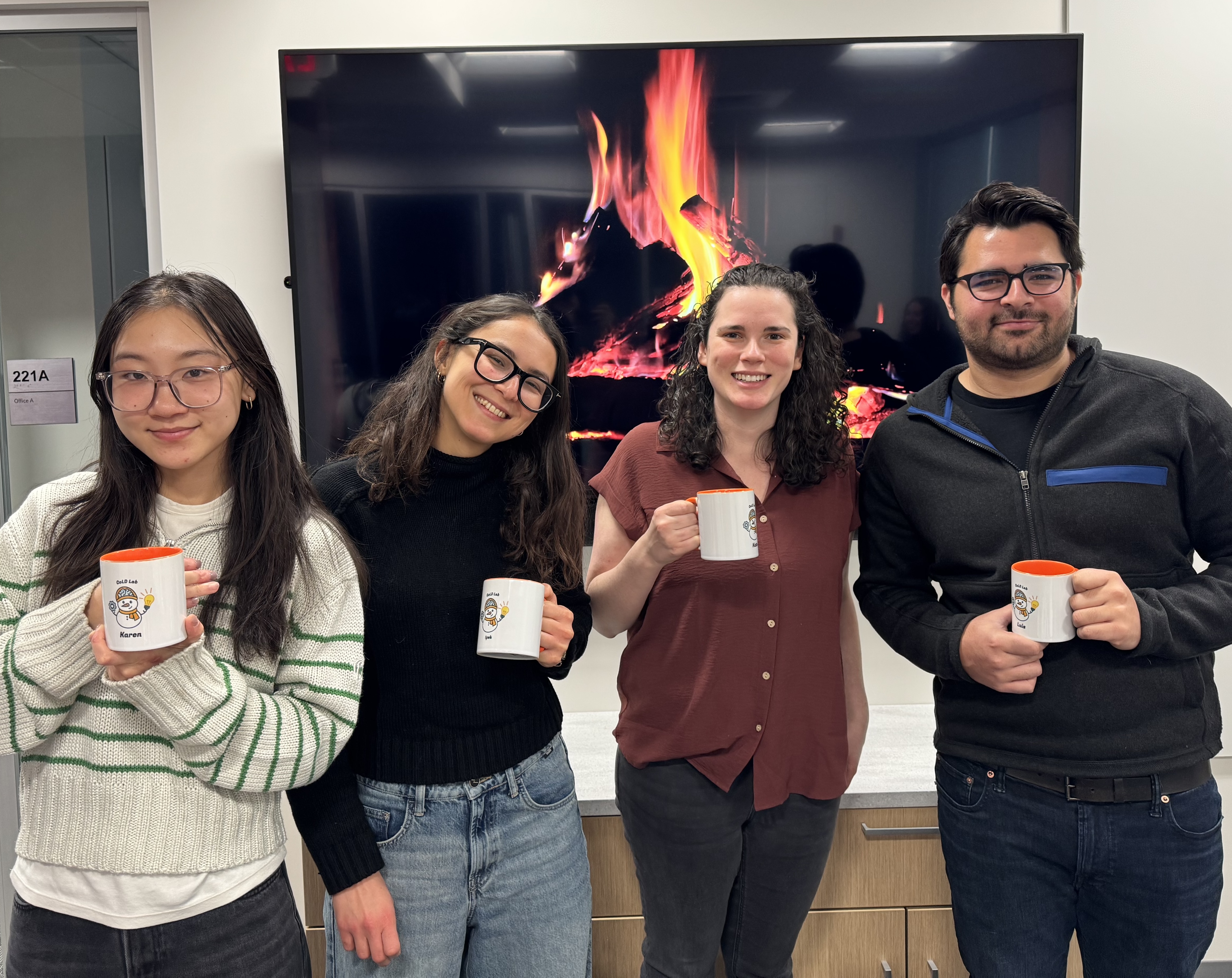 Us holding our new lab mugs